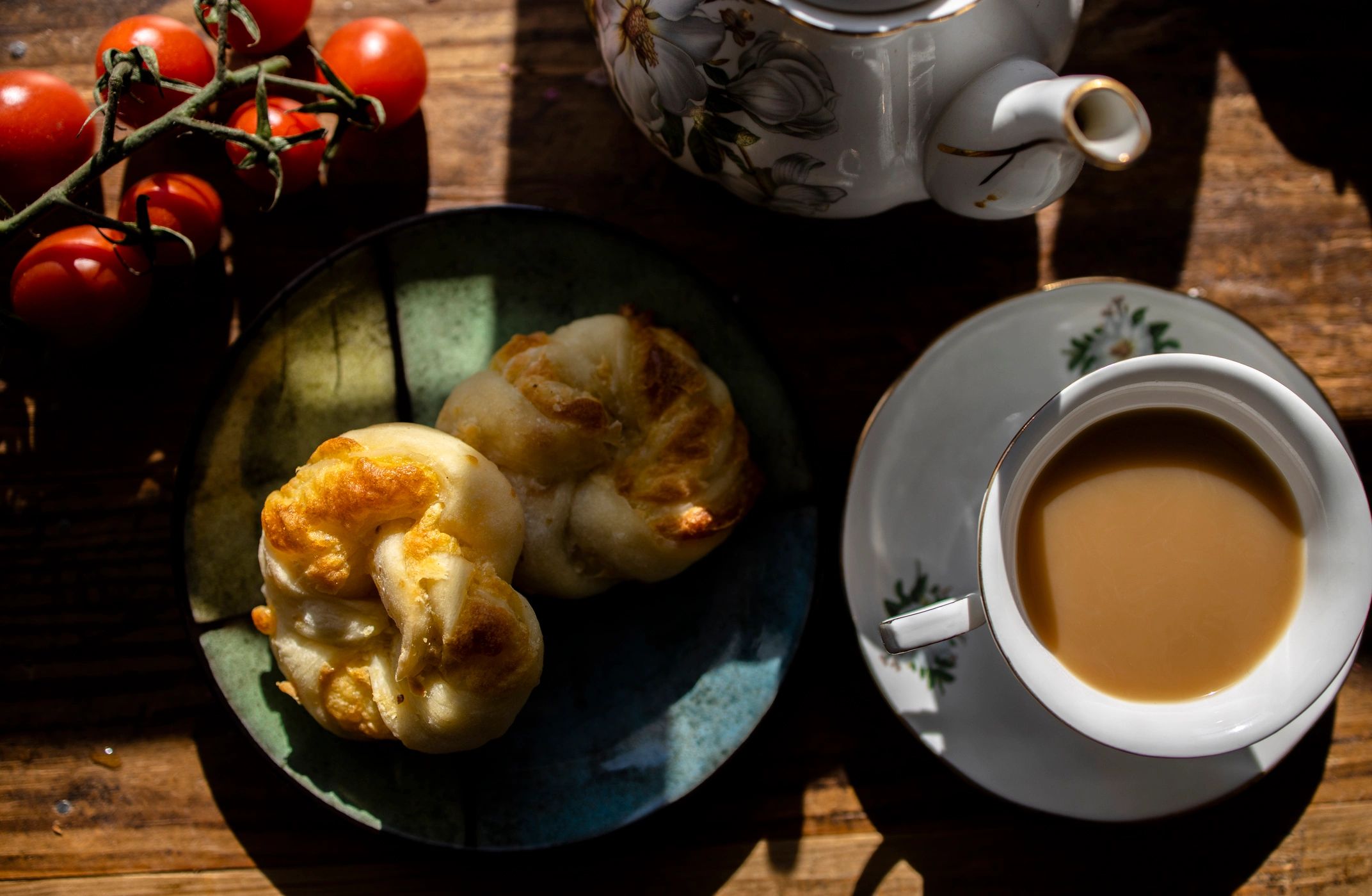 Tea and pastries arranged on a cozy table
