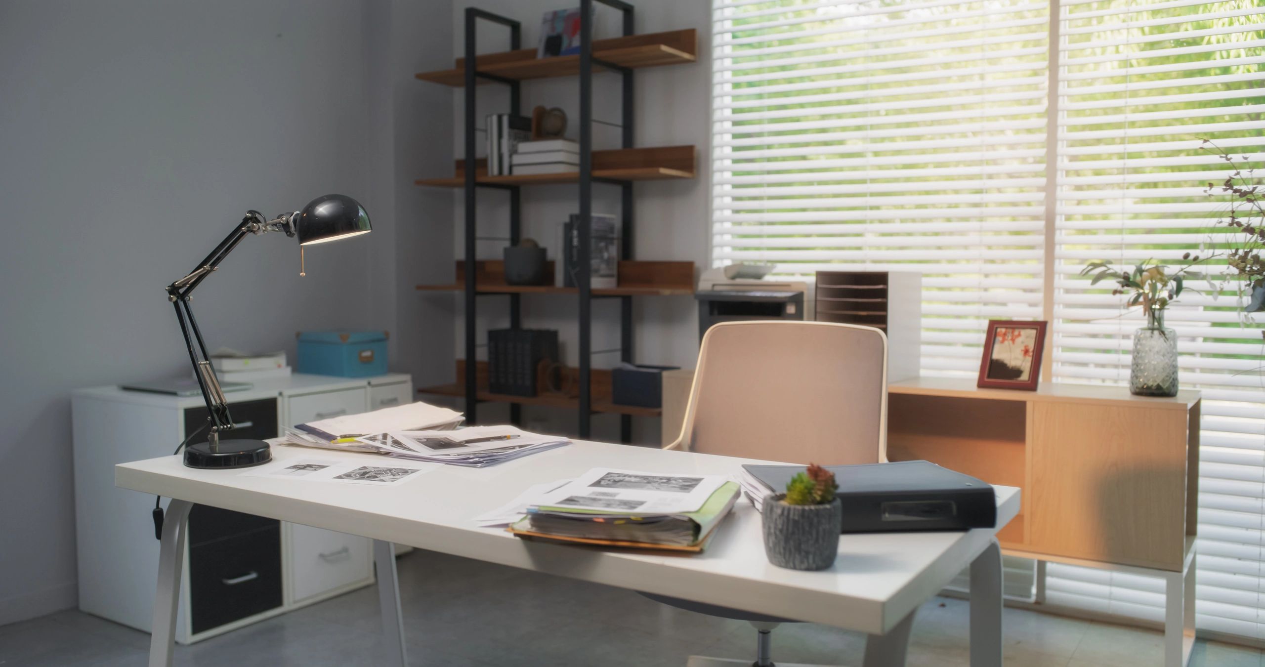 Cozy writer workspace with desk, books, and natural light