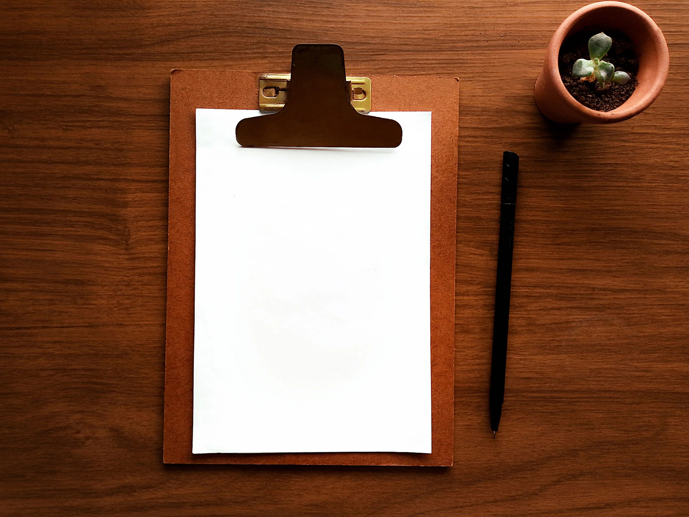 Creative planning materials on a wooden desk